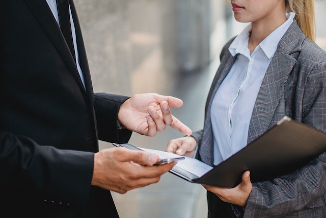 two people reviewing documents